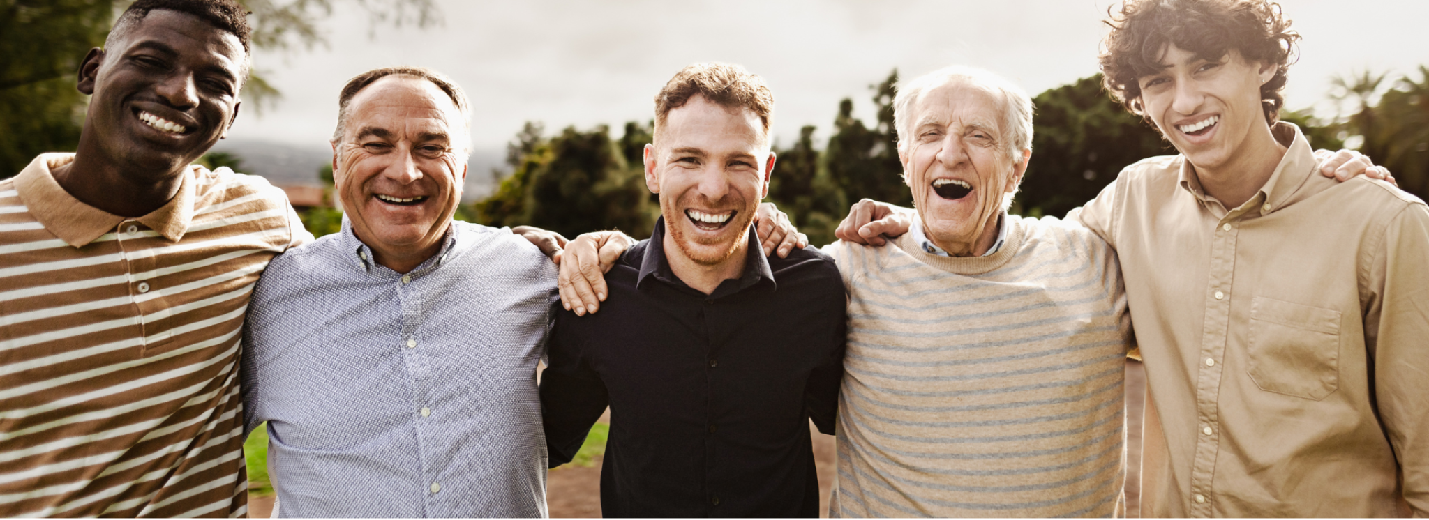 Smiling community members standing shoulder to shoulder